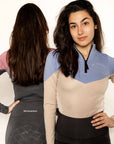Two models wearing two tone equestrian base layers with 1/4 zip detail and mesh side panels.