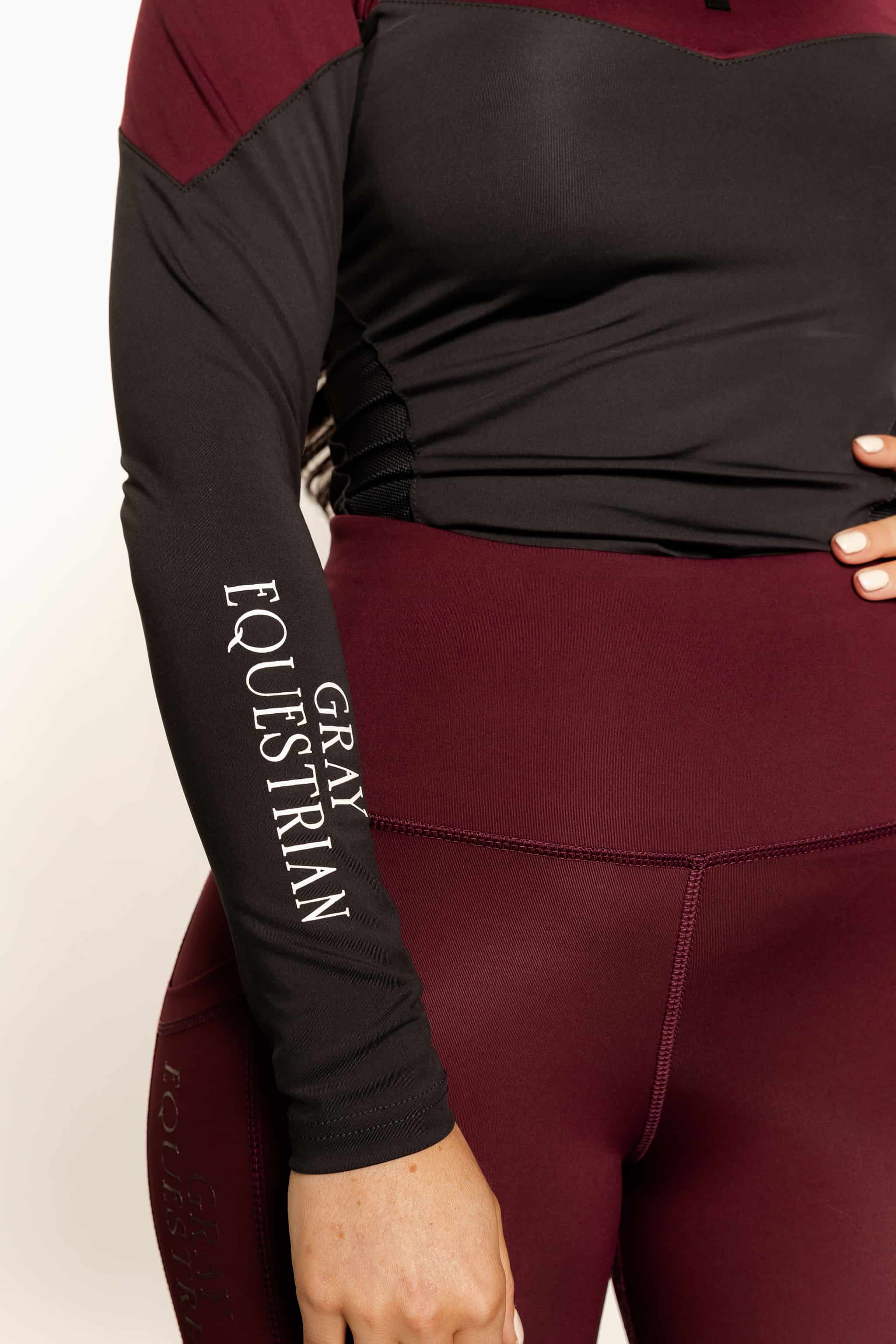 Close up details of two tone grey and burgundy base layer top.