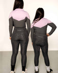 Young rider wearing lilac and grey base layer and grey leggings from behind
