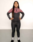 Young rider wearing grey and pink base layer and grey leggings