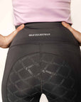 Close up of grey riding leggings with full seat details.