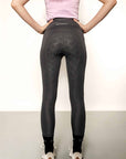Grey riding leggings with lilac base layer.
