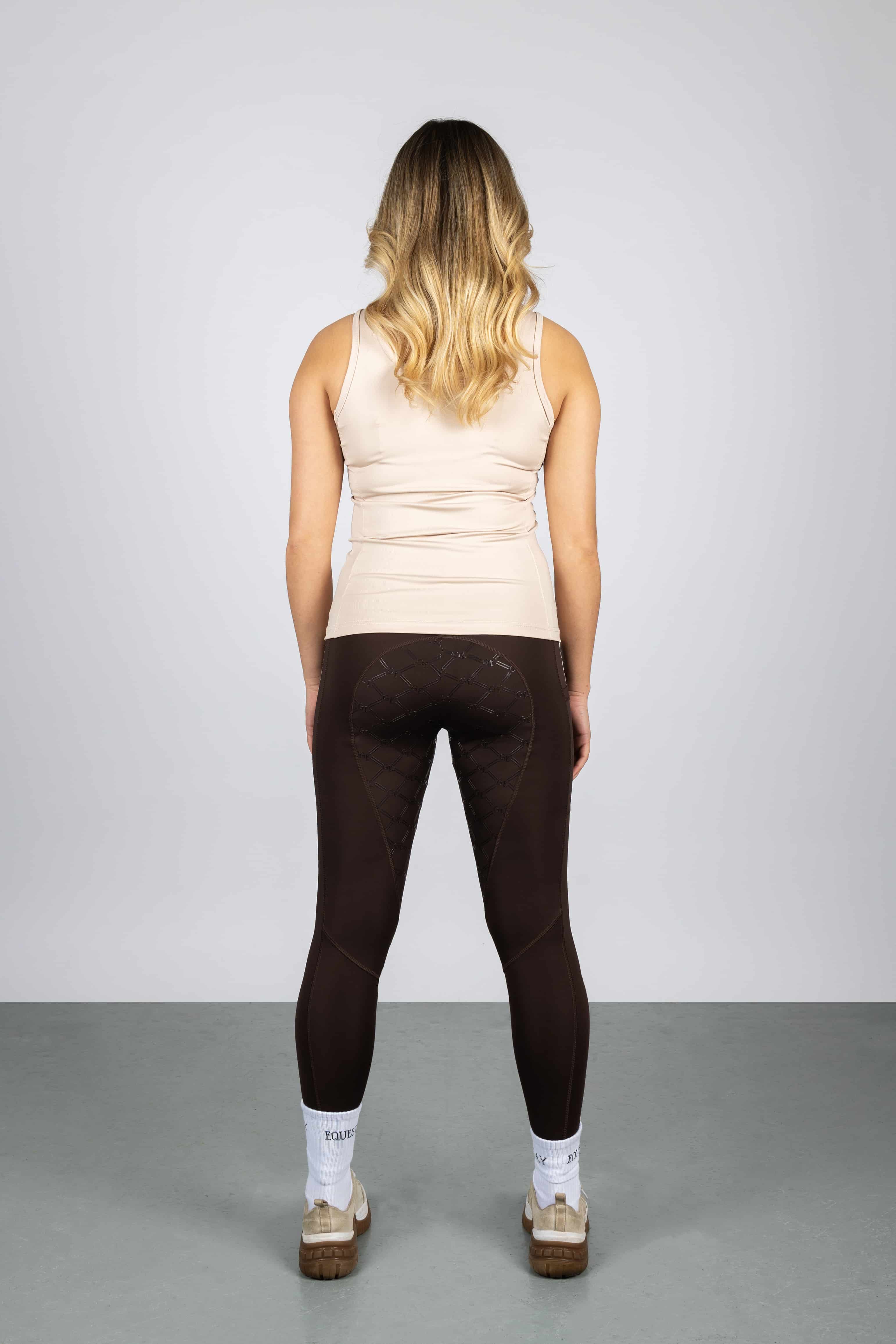 A view of the back of our brown equestrian leggings with full non slip seat.
