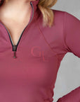 Close up of the zip detail on our berry equestrian base layer.