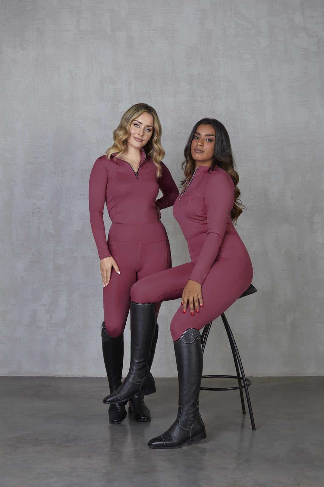 Two models wearing our fleece-lined berry base layer and matching leggings.