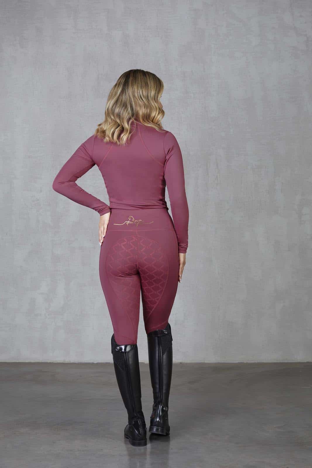 The back of our fleece-lined berry riding leggings with full non-slip seat.