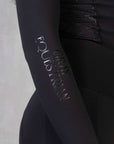 A close up of our long sleeve with black Grey Equestrian detailing.