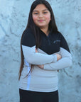 Our child model wearing our black and grey two toned base layer and black riding leggings.