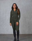 A brunette model wearing our long sleeved fleece lined khaki base layer with matching khaki leggings.