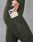 A view of the side of our leggings with it's phone pocket and subtle Gray Equestrian branding.