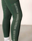 A close-up of the side of our green riding leggings with white GREY EQUESTRIAN detailing.