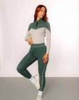 A model wearing our green and grey two toned base layer and matching green riding leggings.