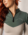 A vide of the front of our long sleeved 1/4 zip grey and green two toned base layer.