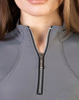A close up of the silver 1/4 zip.