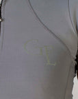 A close up of the grey GE branding on the front of our short sleeved base layer.