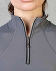 A close up of the silver 1/4 zip.