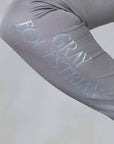 A close up of the subtle grey Gray Equestrian branding on the sleeve.