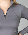 A close up of our grey two toned base layer with silver 1/4 zip and subtle GE branding.