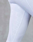 A model wearing our white competition leggings.