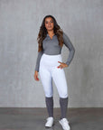 A model wearing our white competition leggings.