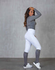 A model wearing our white competition leggings.