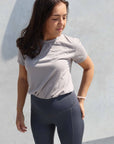Grey riding leggings with taupe grey t shrit.