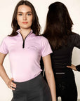 Two models back to back with lilac base layer and grey leggings on and black riding leggings.