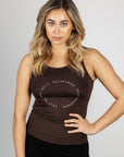 A blonde model wearing our brown scoop neck equestrian vest in a tight-fitting breathable fabric.