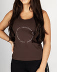 A brunette model wearing our brown scoop neck equestrian vest in a tight-fitting breathable fabric.