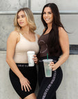 Two models wearing our renew vests.