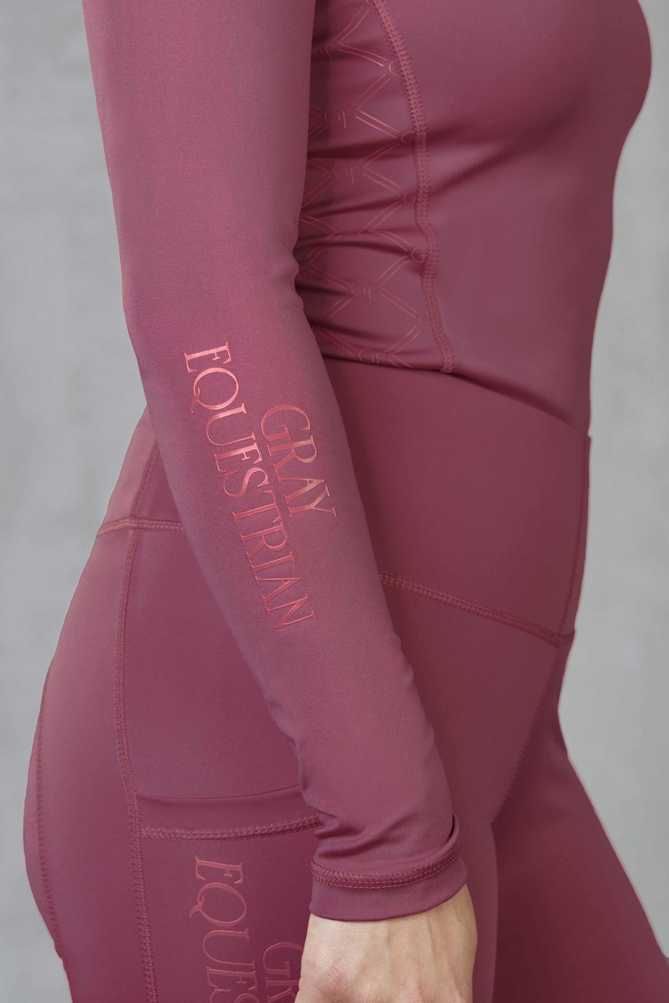 Close up of the side details on our berry pink equestrian base layer.