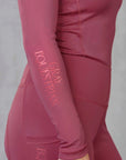 Close up of the side details on our berry pink equestrian base layer.