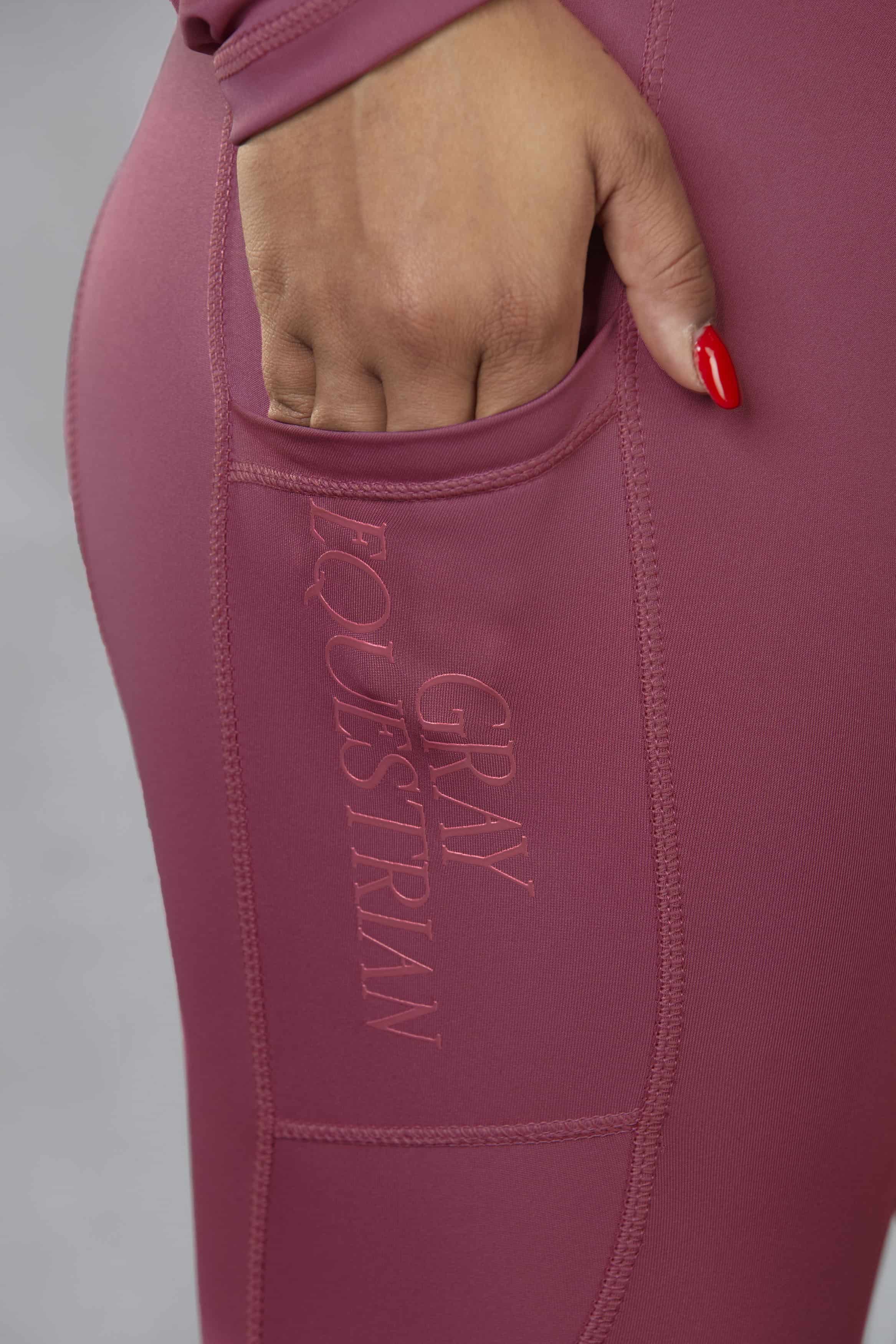 A close up of the sphone pocket in our fleece lined berry leggings.