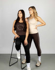 Two models wearing our scoop neck equestrian vests.