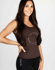 A brunette model wearing our brown scoop neck equestrian vest in a tight-fitting breathable fabric.