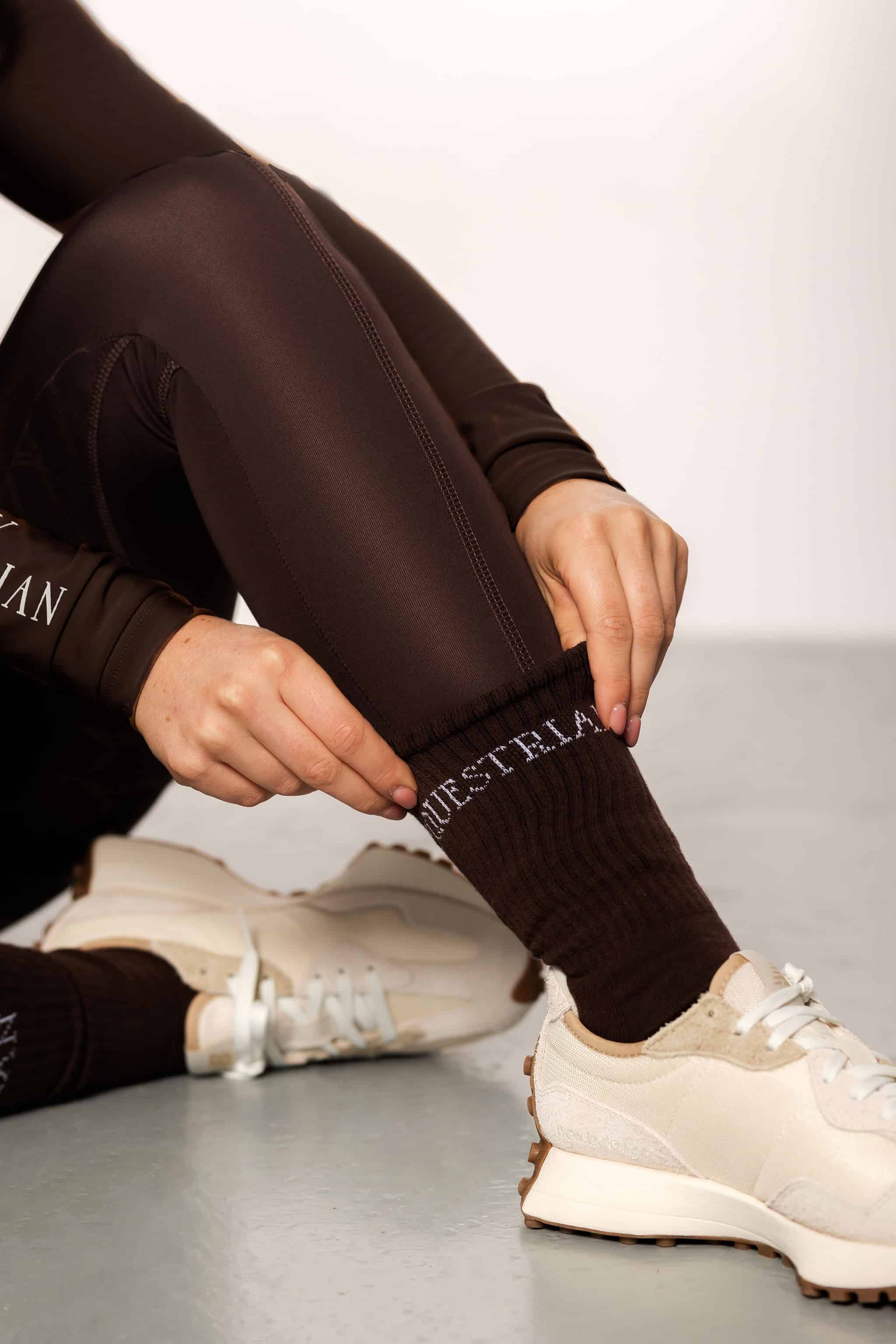 A close-up of our brown fleece lined leggings and matching brown socks.
