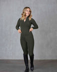 A blonde model wearing our long sleeved fleece lined khaki base layer with matching khaki leggings.