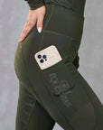 A view of the side of our leggings with it's phone pocket and subtle Gray Equestrian branding.