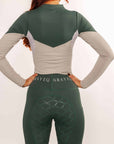 A view of the back of our green riding leggings with full non slip seat.