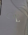A view of the gloss GE branding on the front of our grey base layer.