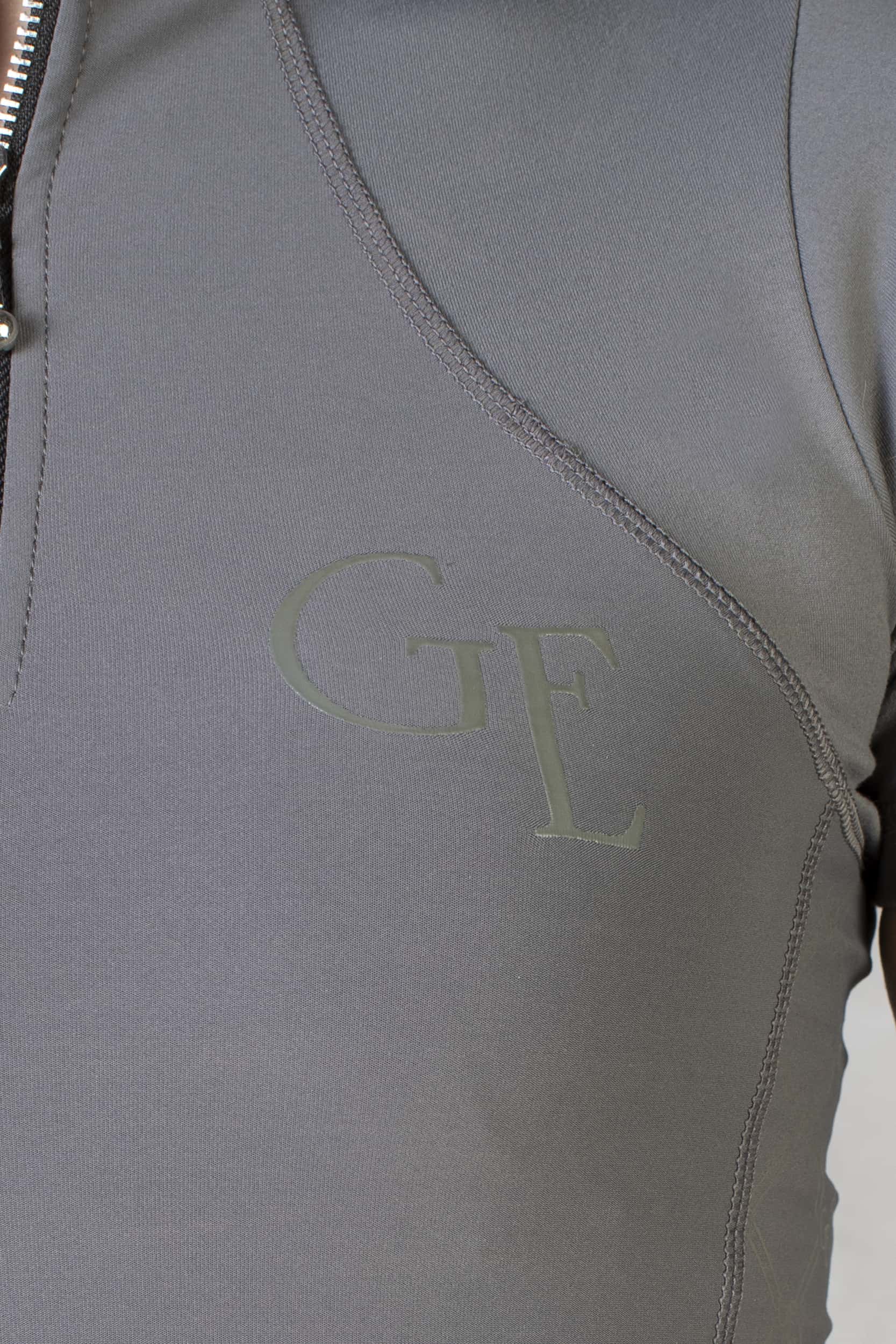 A close up of the grey GE branding on the front of our short sleeved base layer.