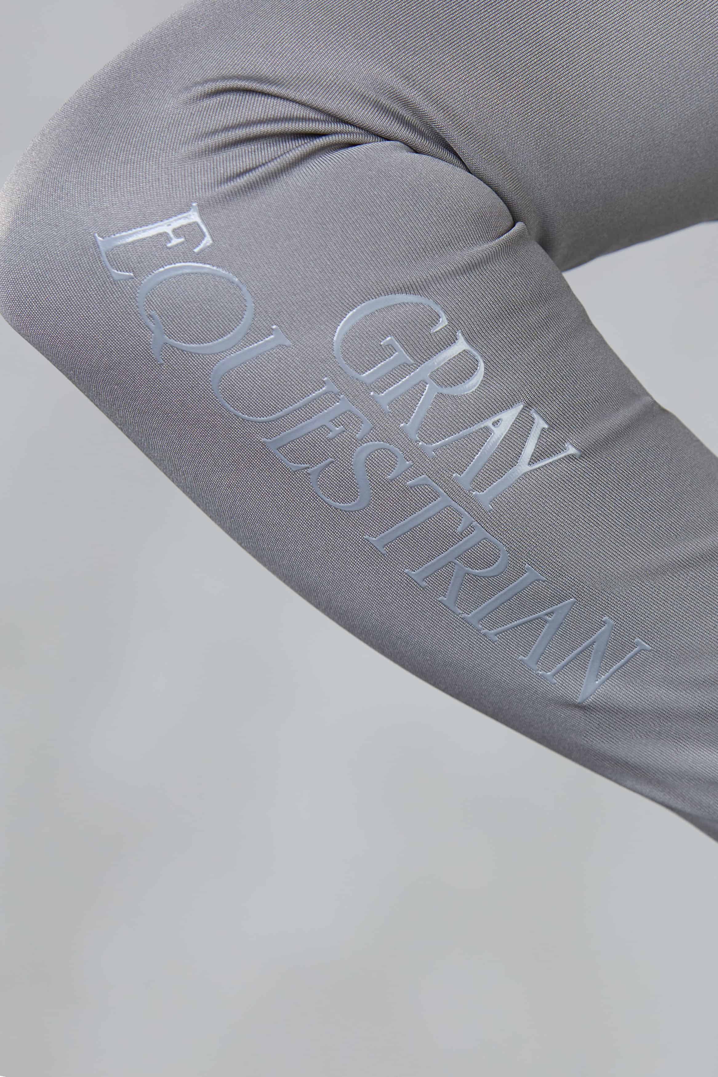 A close up of the subtle grey Gray Equestrian branding on the sleeve.