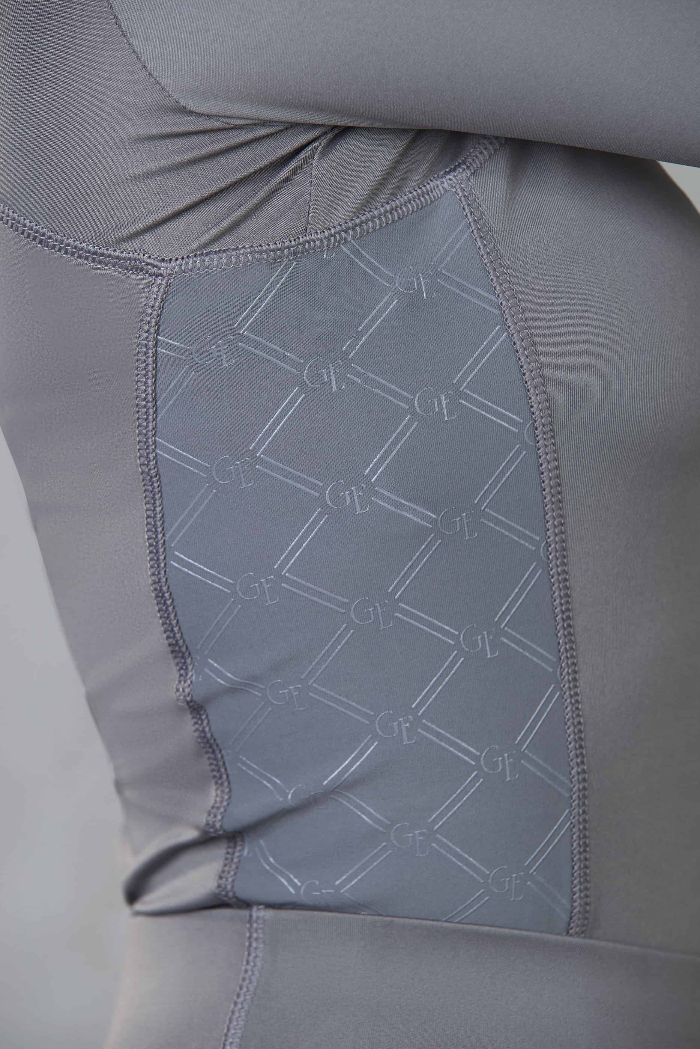 A close up of the dark grey side panel with GE branding.