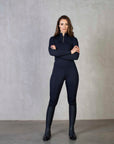 A model wearing our navy base layer and matching riding leggings.