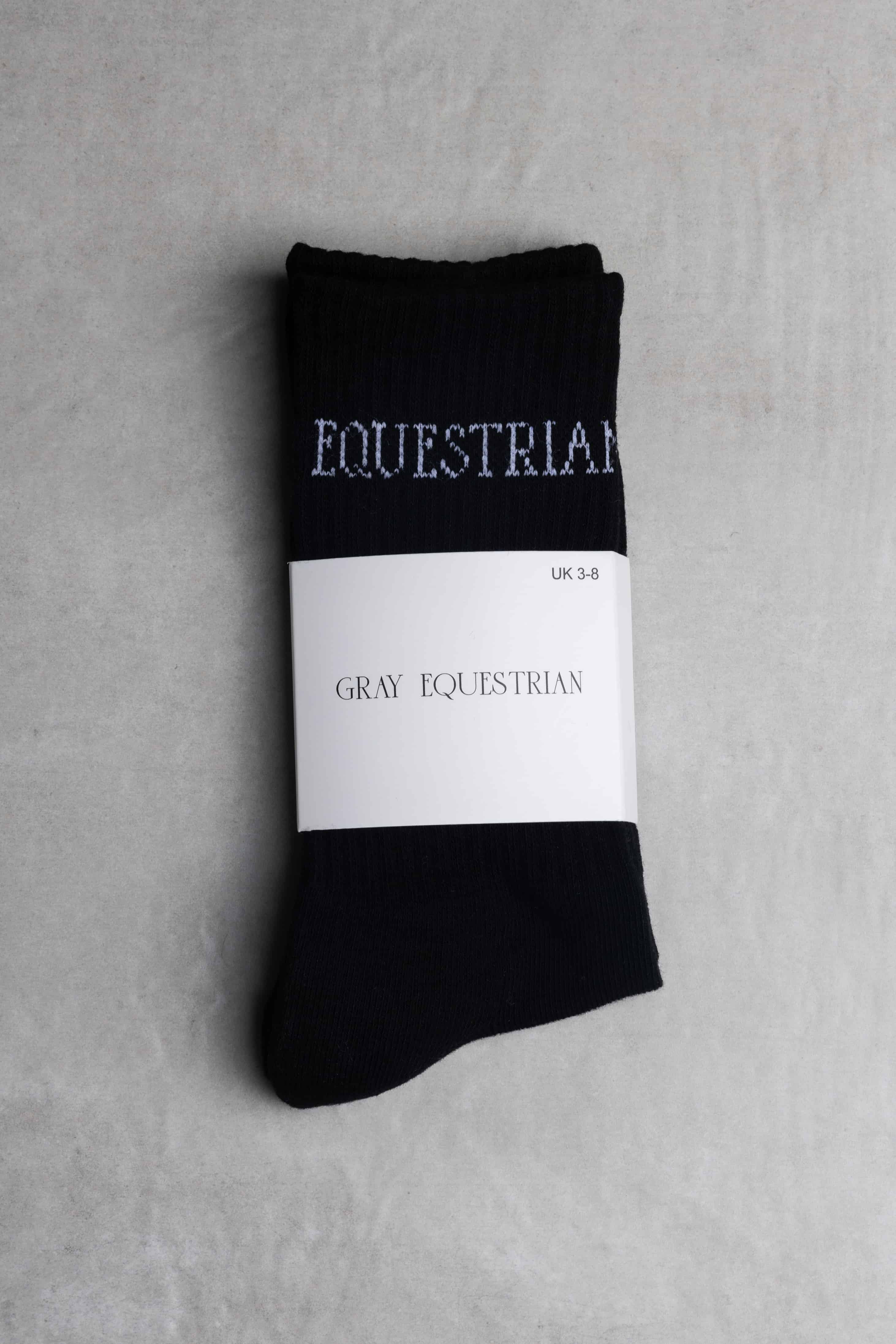 Our black riding socks with white Grey Equestrian branding.