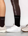 Three models wearing our brown, black and white renew socks.