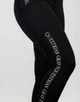 A close up of the subtle white Grey Equestrian branding on our black renew riding leggings.