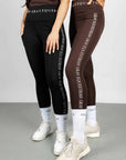Two models wearing our riding leggings and white renew socks.