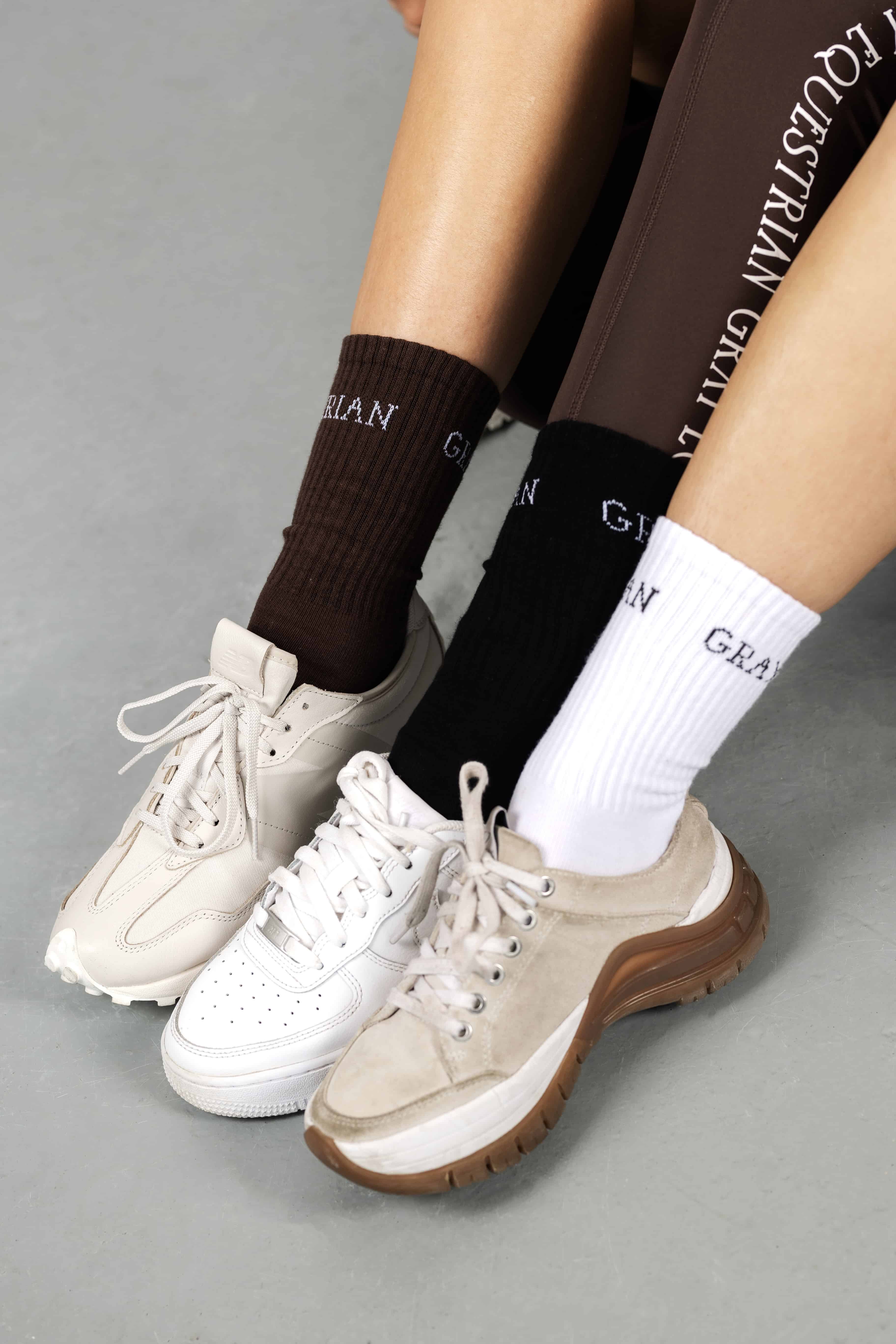 Models wearing our brown, black and white renew socks.