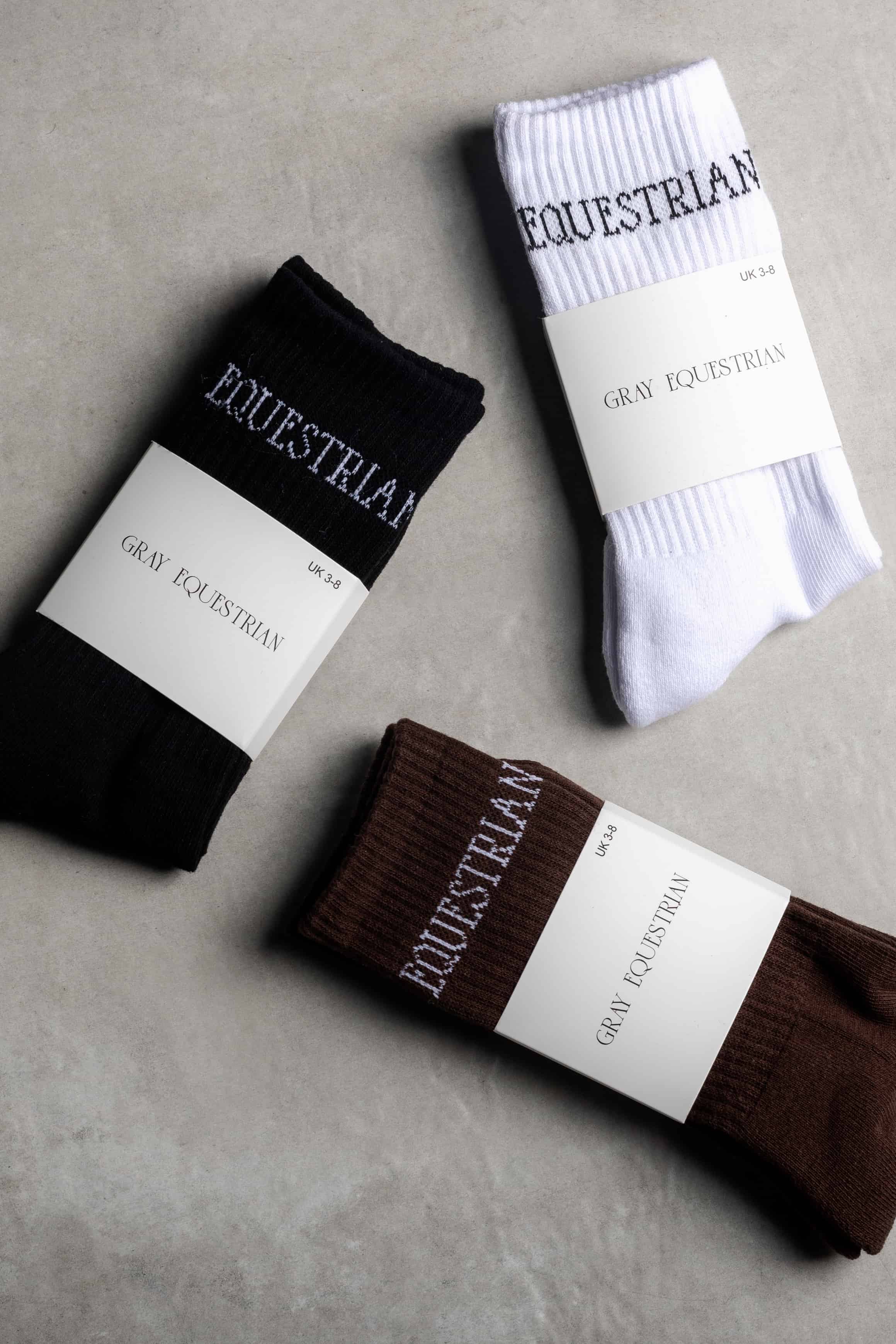 A pack of our white, brown and black renew 3 pack of socks.